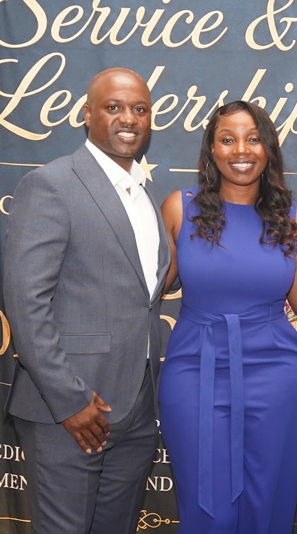 Neco Johnson and his wife at a formal event.
