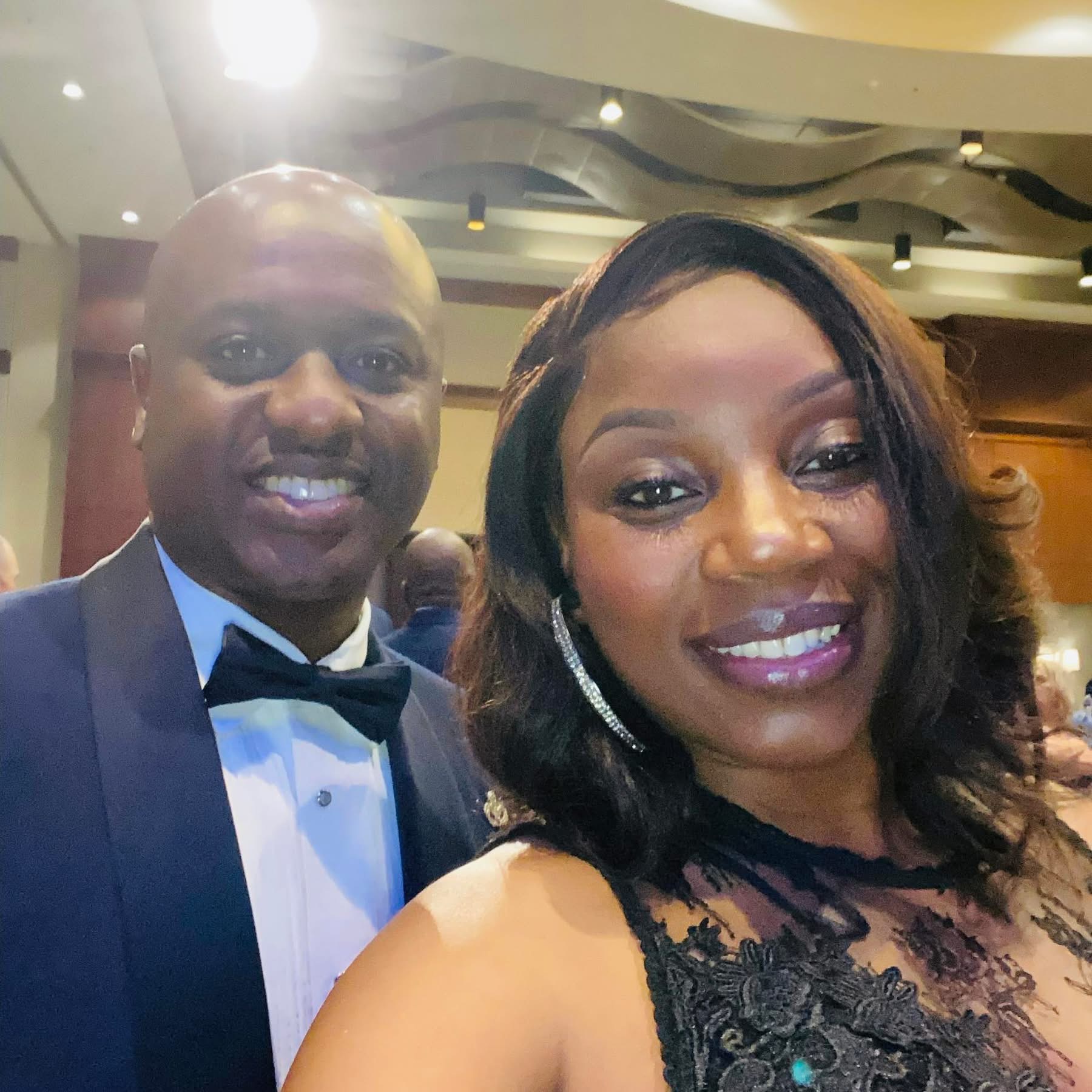 Neco Johnson and his wife smiling together.